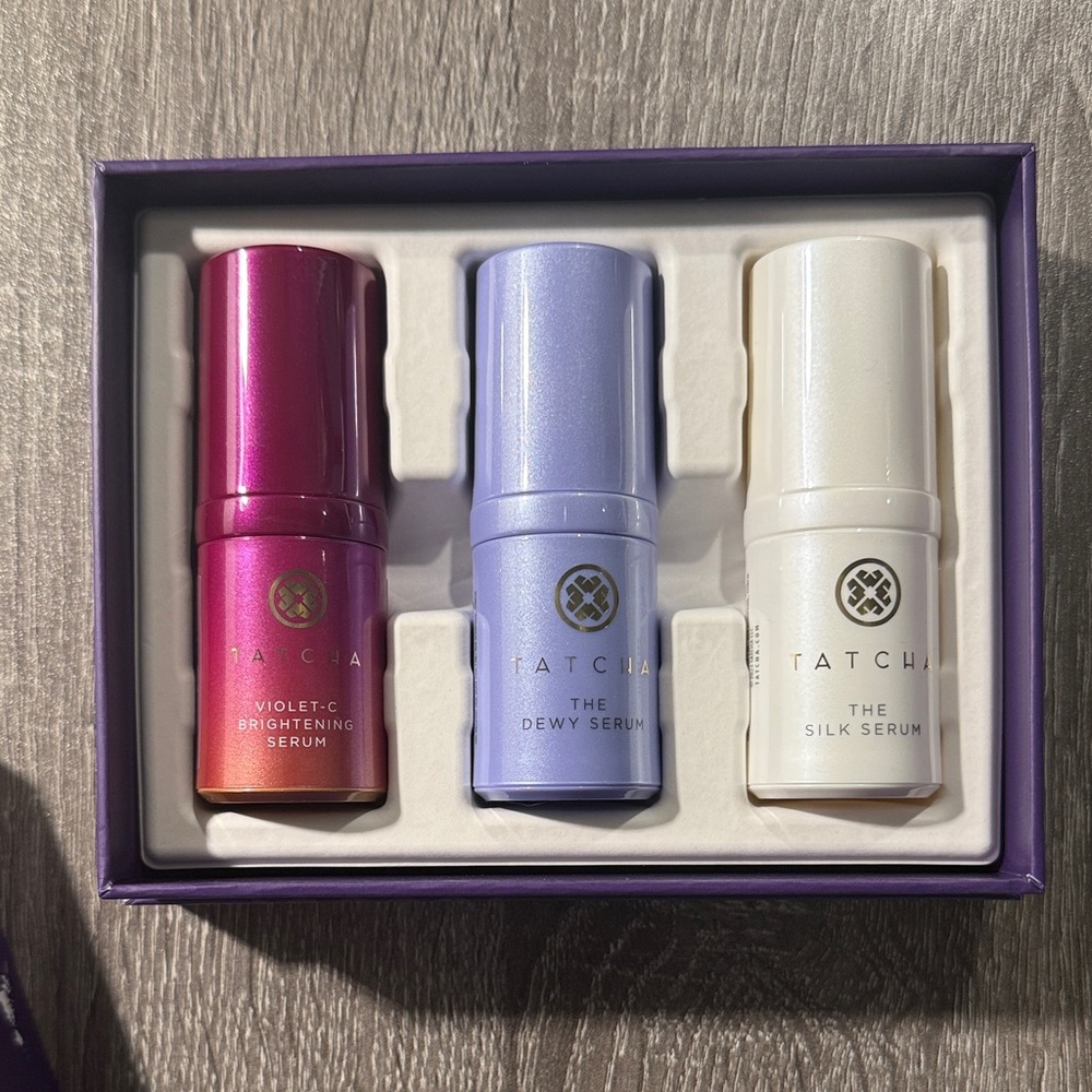 Tatcha Skincare Trio with Pink, Purple, and White Bottles